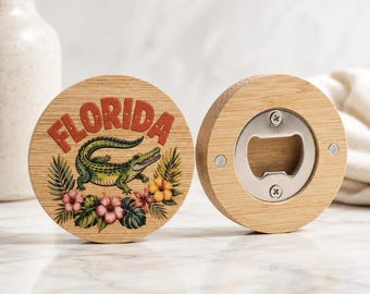May include: Two round wooden bottle openers. One features the word "FLORIDA" in orange letters above a green alligator and tropical flowers. The other has a silver bottle opener mechanism.