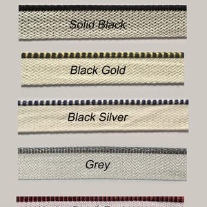 May include: Image showing headbands in black colours. The headbands are labelled Solid Black, Black Gold, Black Silver, Grey, and Black Red. Each headband has a different trim colour, with text labels below each.
