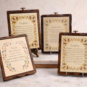 May include: Four wooden framed plaques with printed poems. The frames are dark brown with decorative floral borders. The poems are in a script font with floral and leaf accents. One plaque reads "Friendship".