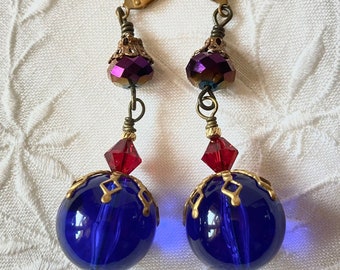 Stunning royal blue Victorian earrings with vintage lucite, sparkly Swarovski Ruby crystals, and purple crystals with blue & red flash