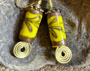 Sunny yellow ceramic barrel bead earrings with glittery copper floral motif and brass coils, Rustic lightweight artisan earrings under 25