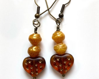 Glowing boho amber glass heart earrings with golden honey swirl glass beads, Vintage star sprinkled gossamer Czech glass heart earrings