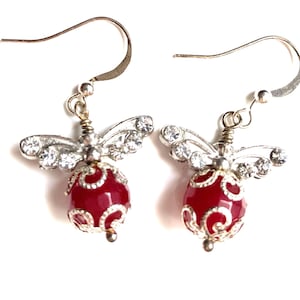 Sparkly rhinestone butterfly and ruby earrings with sterling filigree