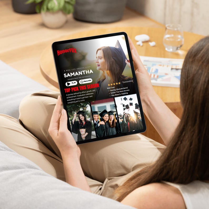 May include: A person holding a black tablet displaying a movie poster for "Samantha." The poster features a woman in a graduation cap. The tablet screen also shows images of graduates and the text "Top Pick This Season."
