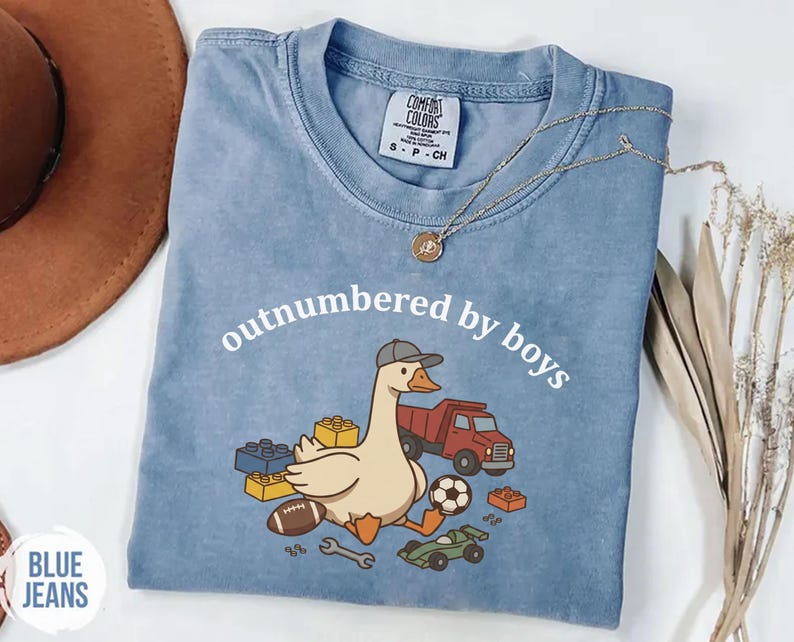Blue jean shirt featuring boy mom design with goose, truck, and blocks