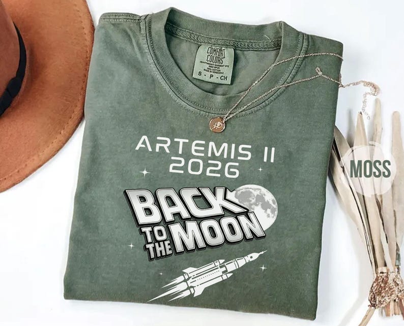 Moss Comfort Colors Back To The Moon NASA shirt with Artemis II rocket launch illustration