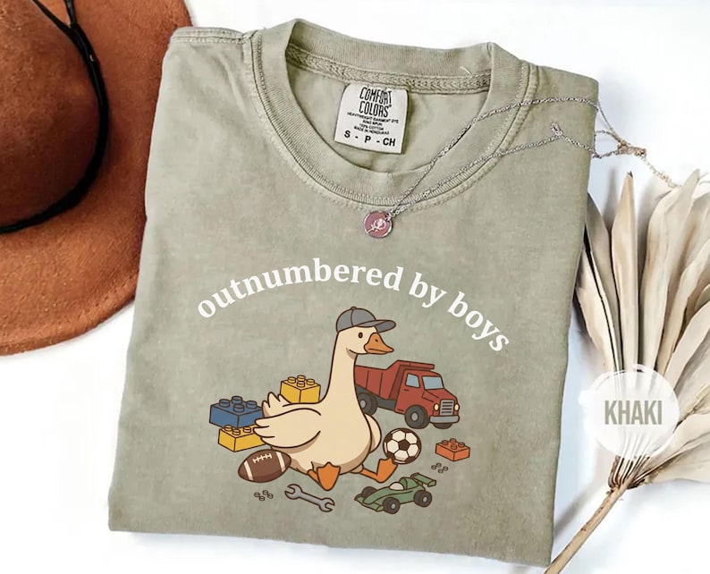 Neutral khaki shirt with boy-themed goose illustration