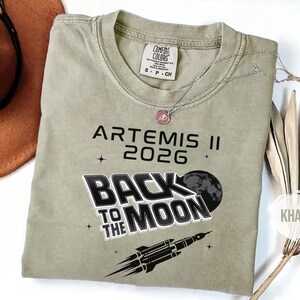 Khaki Comfort Colors NASA moon mission tee with Artemis II 2026 Back To The Moon graphic