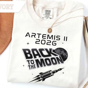 Ivory Comfort Colors Artemis II 2026 Back To The Moon shirt with black moon and rocket design