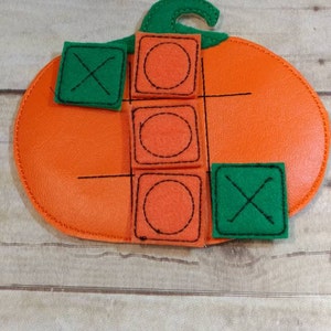 Vinyl handcrafted pumpkin tic tac toe game for boys and girls. Can be used as a gift or party favor.