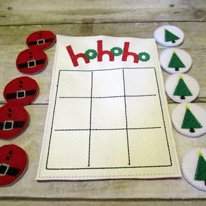 Handcrafted jolly Christmas tic tac toe game for boys and girls. Can be used as a gift or party favor.