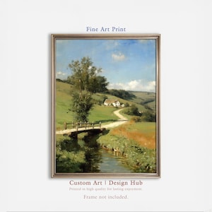 Puede incluir: Una impresión artística enmarcada de una pintura de paisaje. La obra representa un puente sobre un arroyo, un camino sinuoso y una casa en una ladera verde bajo un cielo azul. El texto "Fine Art Print" y "Custom Art | Design Hub" son visibles.