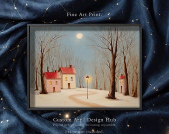 May include: A framed fine art print depicting a winter landscape. The artwork features small houses with red roofs, bare trees, and a winding path under a full moon. The print is set against a dark blue fabric with a constellation pattern.