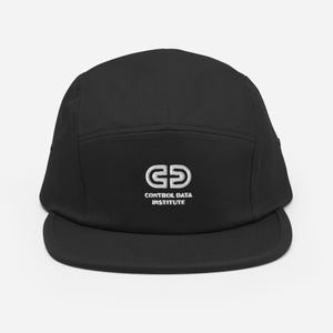 May include: Black five-panel cap with a flat brim. The cap features white embroidered text and a logo that reads "CONTROL DATA INSTITUTE". The hat is made of a durable fabric and has a classic, casual style.