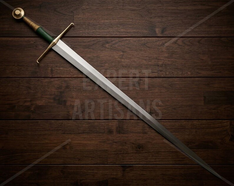 May include: A longsword featuring a double-edged steel blade, a straight brass crossguard, and a green grip wrapped in cord. The pommel is a circular brass disc. The sword is positioned diagonally across the frame with a metallic finish.
