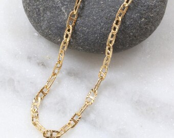 Cadena de capas con ancla Starburst bañada en oro de 14 quilates