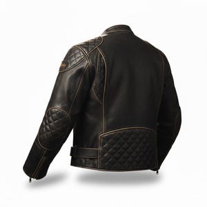 May include: A black leather motorcycle jacket with diamond-stitched shoulder and elbow pads, and a diamond-stitched lower back panel. The jacket has a distressed, vintage look with brown trim and a small logo patch on the left shoulder.