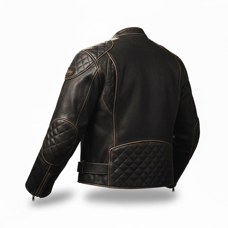 May include: A black leather motorcycle jacket with diamond-stitched shoulder and elbow pads, and a diamond-stitched lower back panel. The jacket has a distressed, vintage look with brown trim and a small logo patch on the left shoulder.