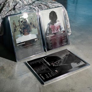 May include: Three framed music album posters featuring Ken Carson. The left poster is titled xperiment, the top right is More Chaos, and the bottom is A Great Chaos. Each poster displays a tracklist, release date, and album length in a dark layout.