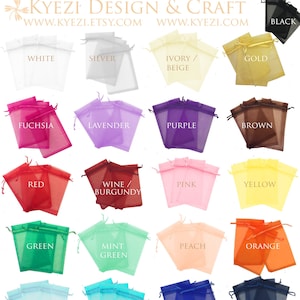 May include: A collection of 16 small organza bags in various colors, including white, silver, ivory, gold, fuchsia, lavender, purple, brown, red, wine, pink, yellow, green, mint green, peach, orange, light blue, turquoise, blue, and navy blue. The bags are arranged in four rows of four bags each. Each bag has a drawstring closure.