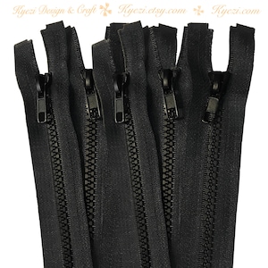 Könnte beinhalten: Fünf schwarze Reißverschlüsse mit Metall-Schiebern. Die Reißverschlüsse sind etwa 25 cm lang.