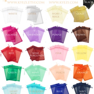 May include: A collection of 16 different colored organza bags, each with a drawstring closure. The bags are arranged in a grid pattern, with the colors ranging from white to black. The text "KYEZI DESIGN & CRAFT" is at the top of the image, along with the website addresses "WWW.KYEZI.ETSY.COM" and "WWW.KYEZI.COM".