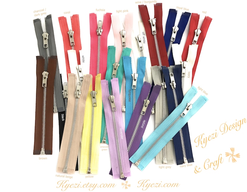 May include: Assortment of 20 zipper closures in various colors, including charcoal, dark grey, cool, fuchsia, light pink, wine, burgundy, royal blue, red, white, black, brown, off white, purple, ivory, light blue, light grey, navy blue, natural beige, and yellow.  Kyezi Design & Craft.