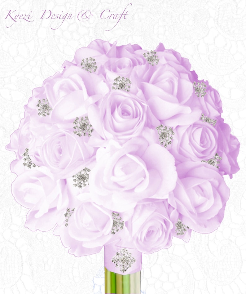 May include: A bouquet of lavender roses with silver embellishments. The roses are arranged in a circular shape and tied with a ribbon. The bouquet is on a white background.