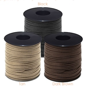May include: Three spools of suede cord in black, tan, and dark brown. The spools are labeled with the color names.