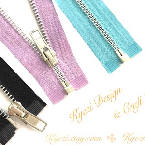 May include: Three zipper closures in black, lavender, and light blue. The zippers have silver teeth and a silver slider.