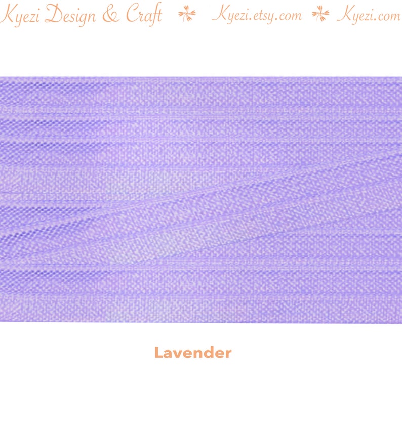 May include: A close-up of a lavender-colored tulle fabric. The fabric has a fine, delicate texture and a soft, flowing drape.