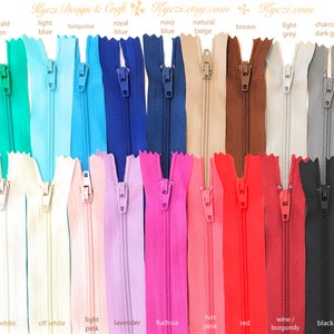 May include: A selection of 16 different colored zippers, each with a metal slider. The colors include emerald green, light blue, turquoise, royal blue, navy blue, natural beige, brown, light grey, charcoal/dark grey, white, off white, light pink, lavender, fuchsia, hot pink, red, wine/burgundy, and black.