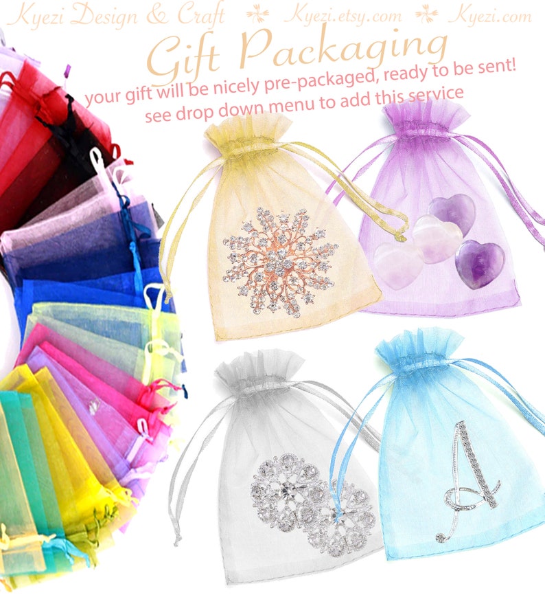 May include: A selection of organza gift bags in a variety of colours, including yellow, purple, silver, and blue. Some bags feature decorative elements. The text "Gift Packaging" is displayed on the image.