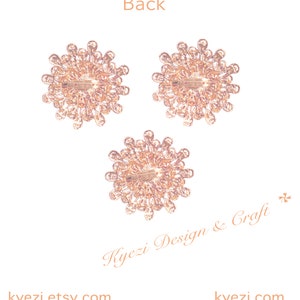 May include: Three rose-gold tone brooches with a floral design. Each brooch has a pin on the back. The word "Back" is at the top of the image. The text "Kyezi Design & Craft" and "kyezi.etsy.com" are also visible.