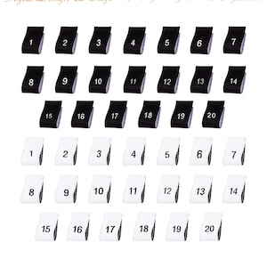 May include: Two sets of twenty black and white fabric labels with numbers 1 through 20 printed on them. The labels are arranged in two rows of ten.