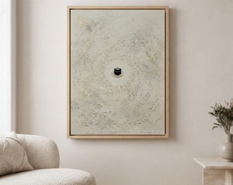 May include: A framed rectangular wall art piece featuring a textured, light beige and cream background with a swirling, galaxy-like pattern. At the center of the composition sits a small, black, cube-shaped structure with gold detailing.