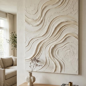May include: A large rectangular wall art piece featuring thick, off-white textured paint applied in sweeping, wavy, raised lines. The artwork displays a monochromatic palette with deep grooves and ridges that create a dynamic, tactile surface.