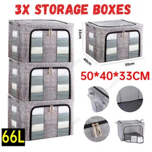May include: Three grey storage boxes, each measuring 50cm x 40cm x 33cm. The boxes have zipped tops and front panels with vertical stripes in grey and white. The image includes the text "3X STORAGE BOXES" and "66L".