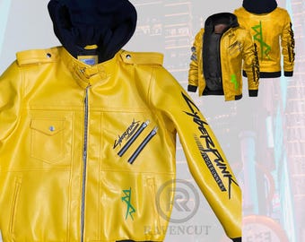 May include: A yellow leather jacket with a black hood and zipper closure. The jacket features black and green graphics, including the text "Cyberpunk Edgerunners" on the sleeve. Two additional jackets are visible in the background.