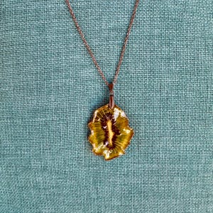 Real Dried Kiwi Oval Shaped Pendant Necklace With Green And Brown Colors on a Bronze Color Chain