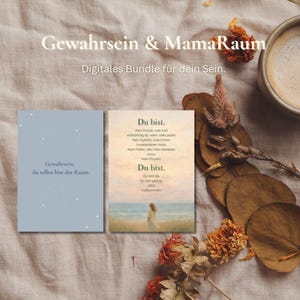 May include: Two digital art prints with German text. One is light blue with the text "Gewahrsein, du selbst bist der Raum." The other print has a woman standing on a beach. The image also includes dried flowers and a cup of coffee.