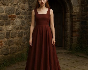 May include: A floor-length, sleeveless dress in a deep reddish-brown hue. The dress features a square neckline and a fitted bodice that flows into a full skirt. The fabric appears to have a subtle texture. The dress is suitable for formal occasions.