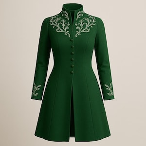 May include: A long, emerald green coat with a high collar and long sleeves. The coat features silver embroidered floral designs on the collar and cuffs, with matching buttons down the front. The coat has a tailored fit and a flared skirt.