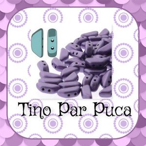 May include: A large quantity of small, purple, crescent-shaped beads with three holes each. The beads are arranged in a pile. The image also includes two small, blue, plastic pieces with holes. The text "Tino Par Puca" is visible at the bottom of the image.