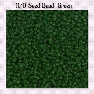 May include: A close-up image of a large quantity of 11/0 seed beads in a dark green color.
