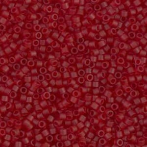 May include: A close-up view of a pile of small, cylindrical red beads. The beads are densely packed together, creating a textured surface. The color is a deep, saturated red, with a slightly translucent appearance.