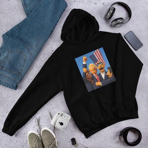 Muppet Trump Hoodie | Funny Political Satire Hoodie | Bold Cartoon Parody | Anti-Trump Gift | Cosy Election Humour Sweatshirt