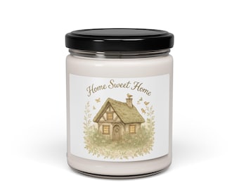May include: A glass jar candle with a black lid. The label features a watercolor illustration of a cottage with the text "Home Sweet Home". The cottage is surrounded by greenery, butterflies, and birds. The candle is a light cream color.