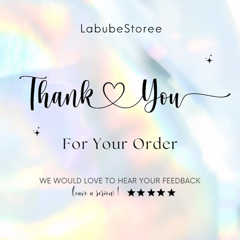 May include: A digital graphic with the text "Thank You For Your Order" in a cursive font, with a heart symbol replacing the "o" in "You". The background has a soft, iridescent effect, with the shop name "LabubeStoree" at the top.