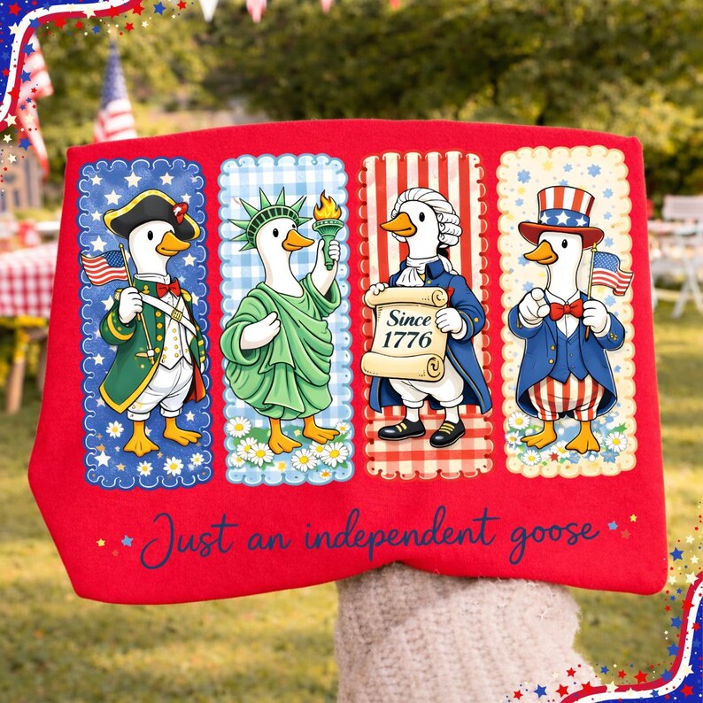May include: Red fabric featuring four cartoon geese dressed in patriotic attire. Each goose represents a different historical figure, holding a flag, torch, or scroll. The text "Just an independent goose" is written in cursive at the bottom.